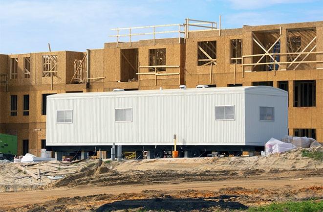 crane lifting modular building for construction office rentals in Lockport, IL